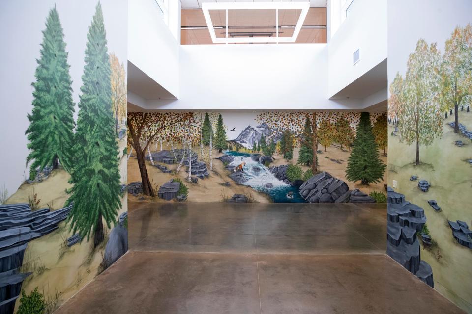 A forest-themed mural created by artist Mary Minor and her team can be seen at the entrance to Bill’s Place at Youth Villages in Memphis, Tenn., on Friday, April 19, 2024. Murals throughout the facility are based on a road trip around the country and give information about each of the states.