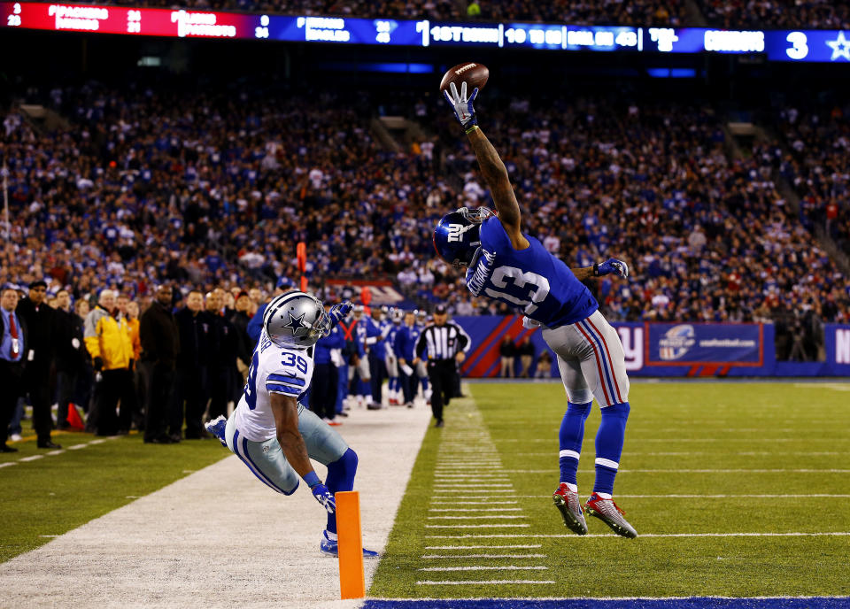 EAST RUTHERFORD, NJ - NOVEMBER 23:  Odell Beckham #13 of the New York Giants scores a touchdown in the second quarter against the Dallas Cowboys at MetLife Stadium on November 23, 2014 in East Rutherford, New Jersey.  (Photo by Al Bello/Getty Images)