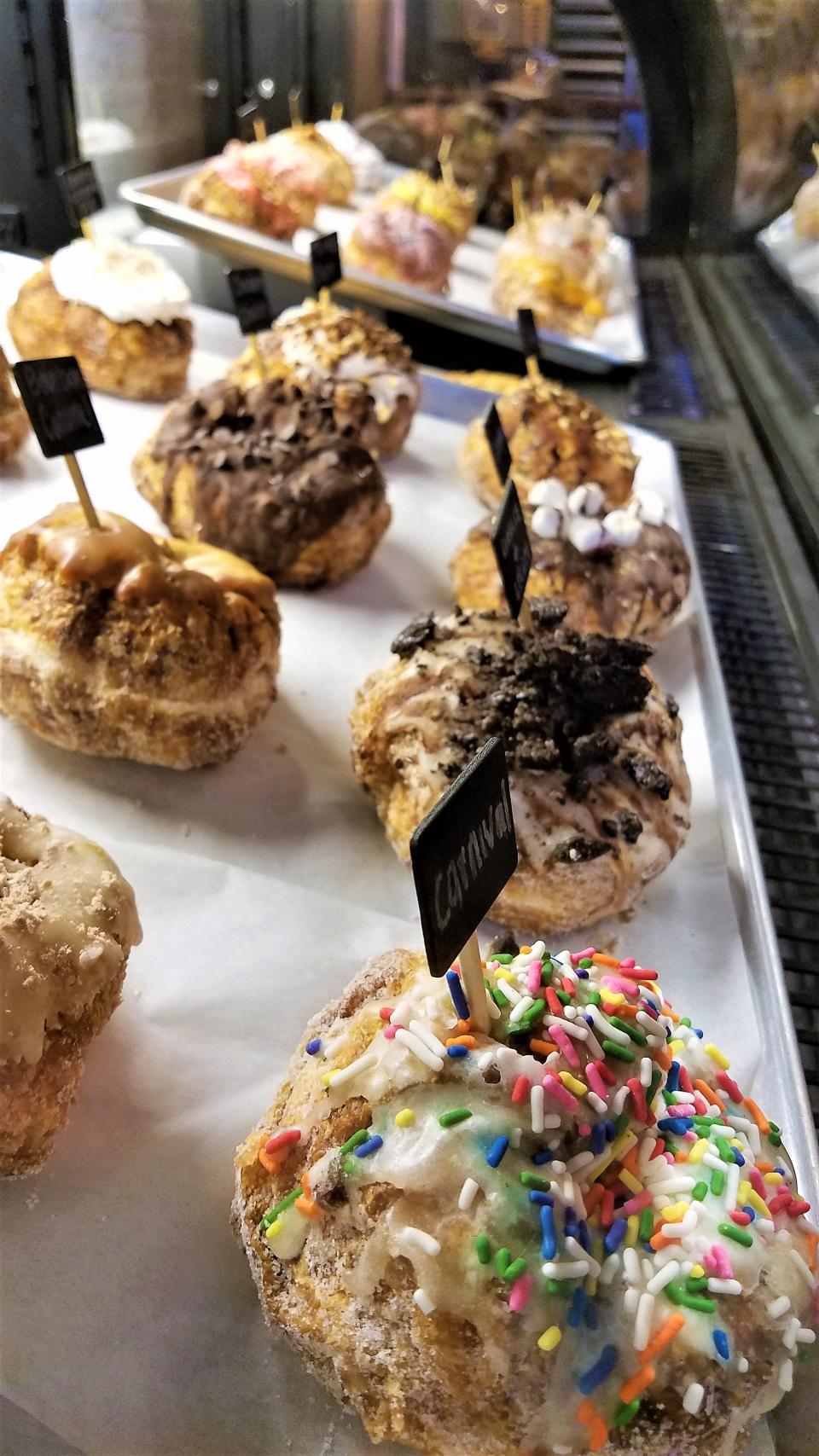 Croissant doughnuts with creative toppings at Parlor Doughnuts.