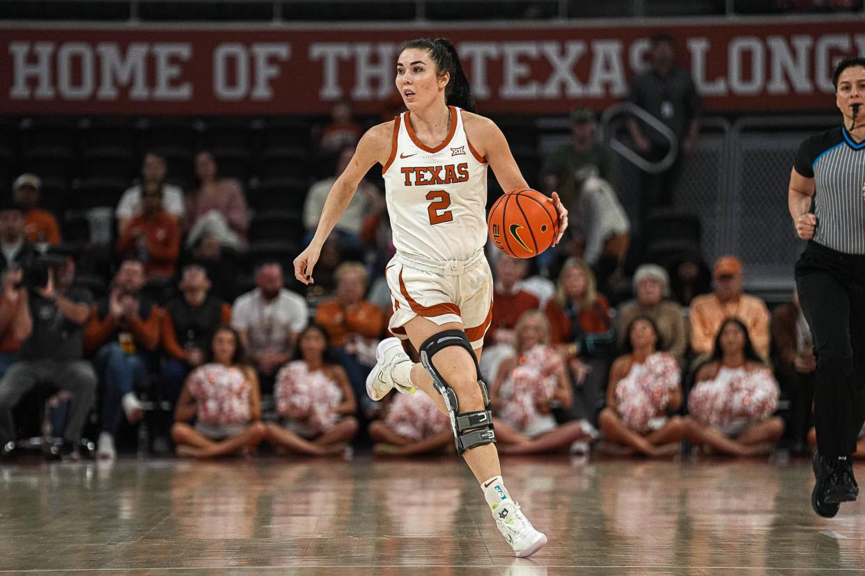 Texas Longhorns guard Shaylee Gonzales (2) dribbles the ball towards the Cincinnati basket during the women’s basketball game at the Moody Center on Saturday, Jan. 27, 2024 in Austin.