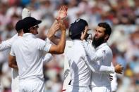Britain Cricket - England v Pakistan - Third Test - Edgbaston - 7/8/16 England's Moeen Ali celebrates taking the wicket of Pakistan's Azhar Ali with teammates Action Images via Reuters / Paul Childs