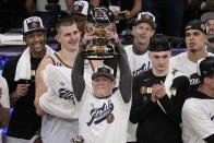 Denver Nuggets head coach Michael Malone lift the conference championship trophy after defeating the Los Angeles Lakers 113-111 in Game 4 of the NBA basketball Western Conference Final series Monday, May 22, 2023, in Los Angeles. (AP Photo/Mark J. Terrill)
