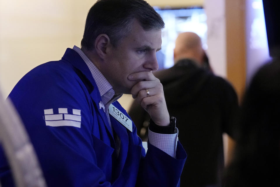 Specialist Thomas Schreck work at his post on the floor of the New York Stock Exchange, Wednesday, Aug. 7, 2024. (AP Photo/Richard Drew)