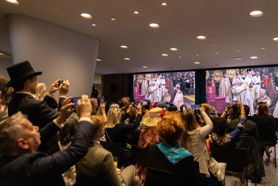 People watch a television screening of the coronation of King Charles III during the Coronation party at Lincoln Center in New York City.<span class="copyright">Jeenah Moon—Getty Images</span>