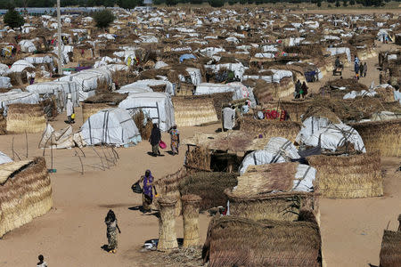 FILE PHOTO: People walk inside the Muna Internally displace people camp in Maiduguri, Nigeria December 1, 2016 REUTERS/Afolabi Sotunde/File Photo