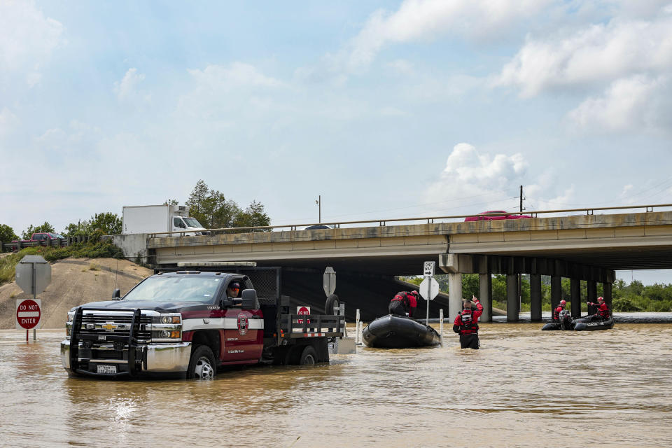 Channelview Fire Department and sheriffs get ready to help evacuate the area due to severe flooding, Saturday, May 4, 2024, in Channelview, Texas. (Raquel Natalicchio/Houston Chronicle via AP)