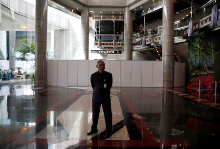 A security guard stands in front of the second floor of the Indonesia Stock Exchange building in Jakarta, Indonesia January 16, 2018. REUTERS/Beawiharta