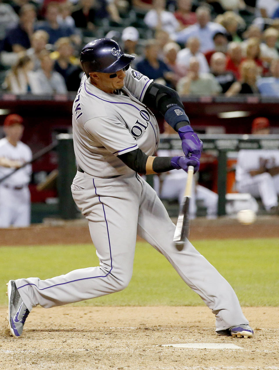 Colorado Rockies' Troy Tulowitzki connects for a two-run home run against the Arizona Diamondbacks during the sixth inning of a baseball game on Tuesday, April 29, 2014, in Phoenix. (AP Photo/Ross D. Franklin)