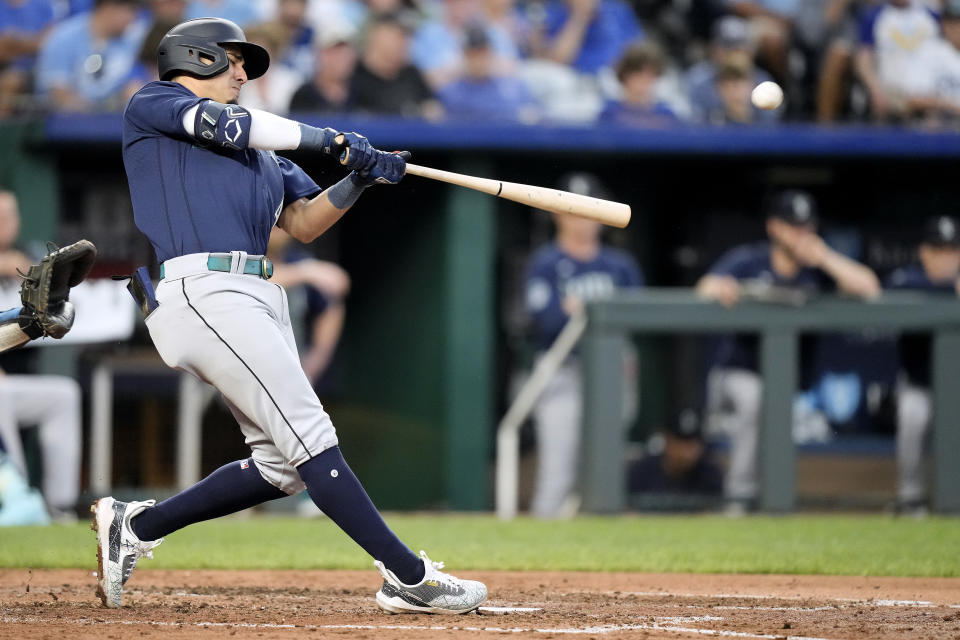 Seattle Mariners' Josh Rojas hits a two-run home run during the fourth inning of a baseball game against the Kansas City Royals Tuesday, Aug. 15, 2023, in Kansas City, Mo. (AP Photo/Charlie Riedel)