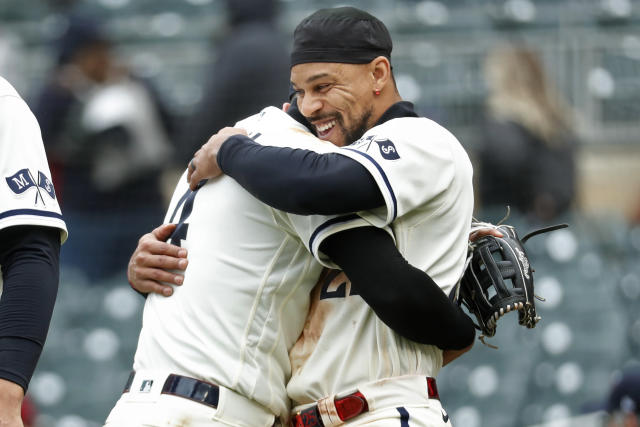 Minnesota Twins pitcher Jhoan Duran, right, hugs catcher Ryan