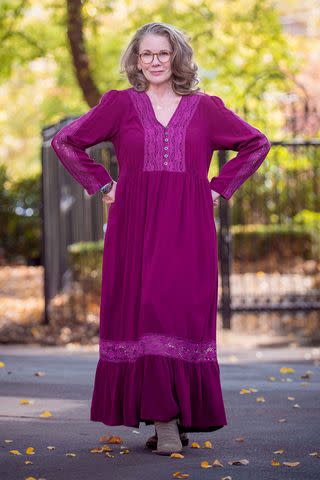 <p>Julie Zahn/Modern Prairie</p> Melissa Gilbert modeling a Modern Prairie dress in 2023.