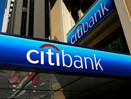 FILE PHOTO -- People walk beneath a Citibank branch logo in the financial district of San Francisco, California July 17, 2009. REUTERS/Robert Galbraith/File Photo