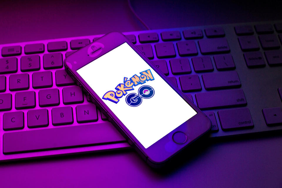 SPAIN - 2021/10/13: In this photo illustration a Pokemon GO logo seen displayed on a smartphone on top of a computer keyboard. (Photo Illustration by Thiago PrudÃªncio/SOPA Images/LightRocket via Getty Images)