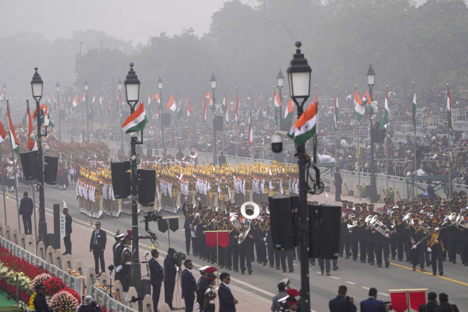 Indian defence forces march through the ceremonial Kartaya Path boulevard during Republic Day celebrations in New Delhi, Thursday, Jan. 26, 2023. Tens of thousands of people shed COVID-19 masks but faced morning winter chill and mist at a ceremonial parade in the Indian capital on Thursday showcasing India's defense capability and cultural and social heritage on a long revamped marching ceremonial boulevard from the British colonial rule.(AP Photo/Manish Swarup)
