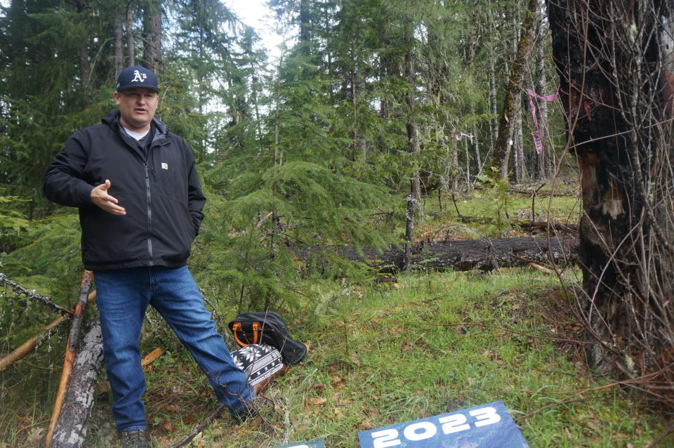 Jesse Jackson, education programs manager for the Cow Creek Band of Umpqua Tribe of Indians, explains how the tribe used fire and broadcast burns to maintain forest health. (Alex Baumhardt/Oregon Capital Chronicle)