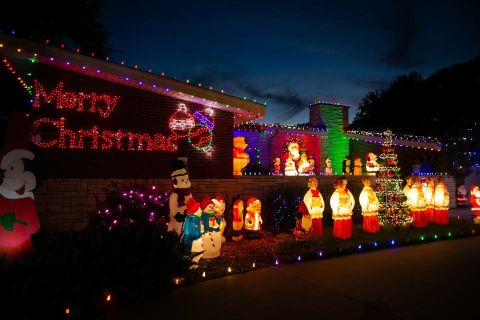 A variety of holiday figures, including 50 snowmen, eight Santa Claus figurines and four bears, are on display at the Snyder and Tagliabue home, nicknamed "Snowcean Drive" at 6025 Ocean Drive in Corpus Christi Monday, Dec. 18, 2023.