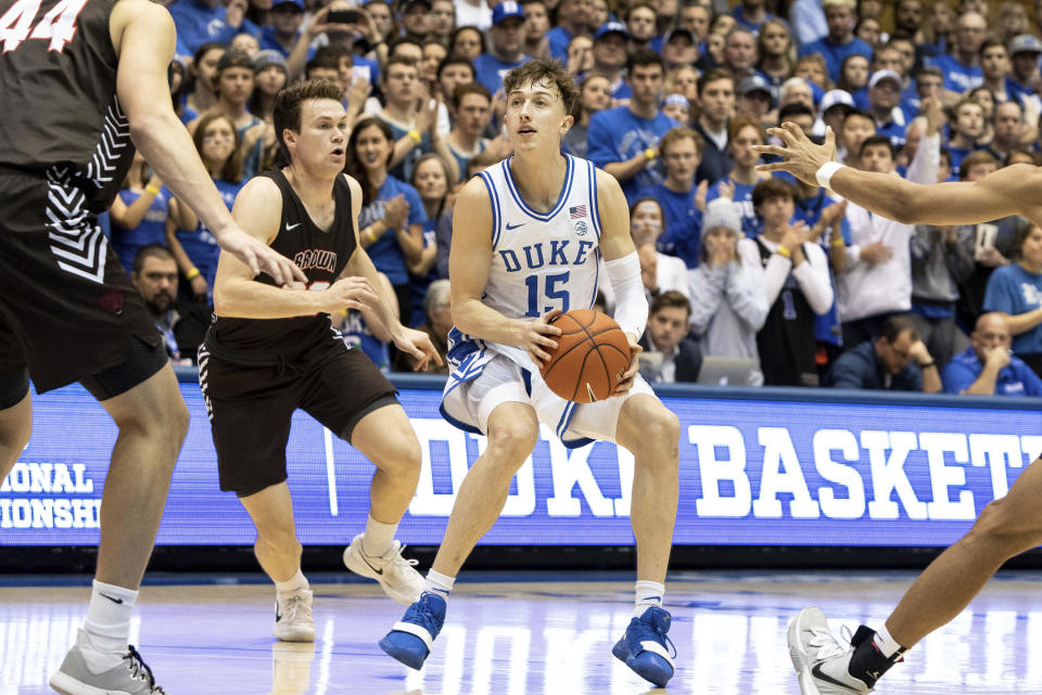 Duke's Alex O'Connell, right, handles the ball ahead of Brown's Zach Hunsaker, left, during the second half of an NCAA college basketball game in Durham, N.C., Saturday, Dec. 28, 2019. (AP Photo/Ben McKeown)