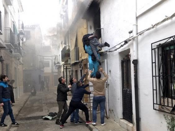 Spain is considering giving Gorgui Lamine Sow, an undocumented migrant from Senegal, residency after he saved a wheelchair-bound man from a flat fire in the city of Denia on 6 December 2019. (Roberta Etter/Reuters)