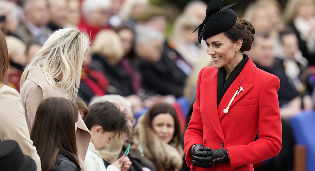 Kate paid tribute to the Welsh Guards in a red coat and leek brooch. (Getty Images)