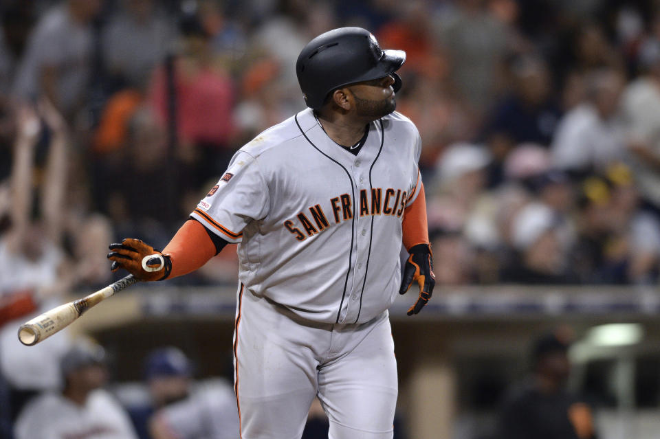 Giants fan makes memorable catch of Pablo Sandoval's game-winning home run. (AP Photo/Orlando Ramirez)