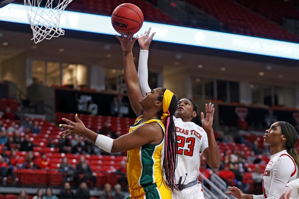 Baylor's Jordan Lewis (3) lays up the ball over Texas Tech's Khadija Faye (23) during the first half of an NCAA college basketball game on Wednesday, Jan. 26, 2022, in Lubbock, Texas. (AP Photo/Brad Tollefson) ORG XMIT: TXBT104