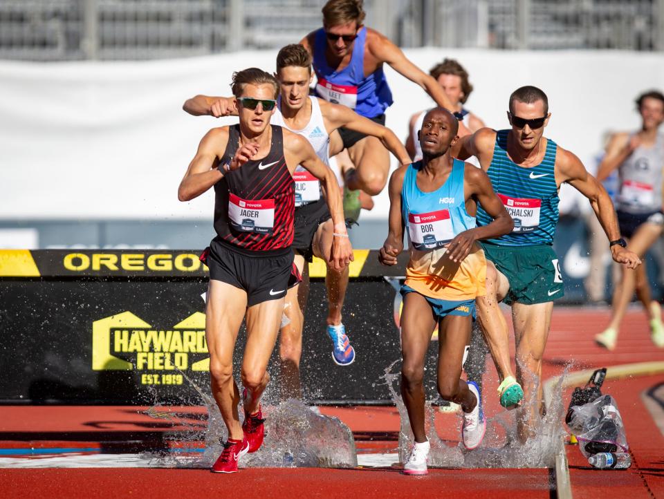 Evan Jager leads the pack over the water jump in the first round of the men’s 3,000 meter steeplechase Thursday, June 23, 2022 at the USA Track and Field Championships at Hayward Field in Eugene, Ore.