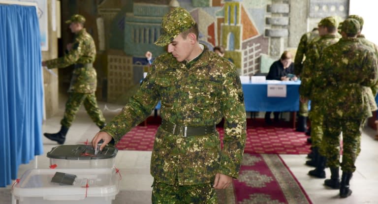 Azeri soldiers vote in Baku on November 1, 2015, during an Azerbaijan election that opposition parties and international observers dismissed as less than fair