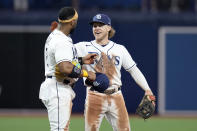 Tampa Bay Rays shortstop Taylor Walls, right, and third baseman Yandy Diaz celebrate the team's win over the Boston Red Sox during a baseball game Wednesday, Sept. 7, 2022, in St. Petersburg, Fla. (AP Photo/Chris O'Meara)