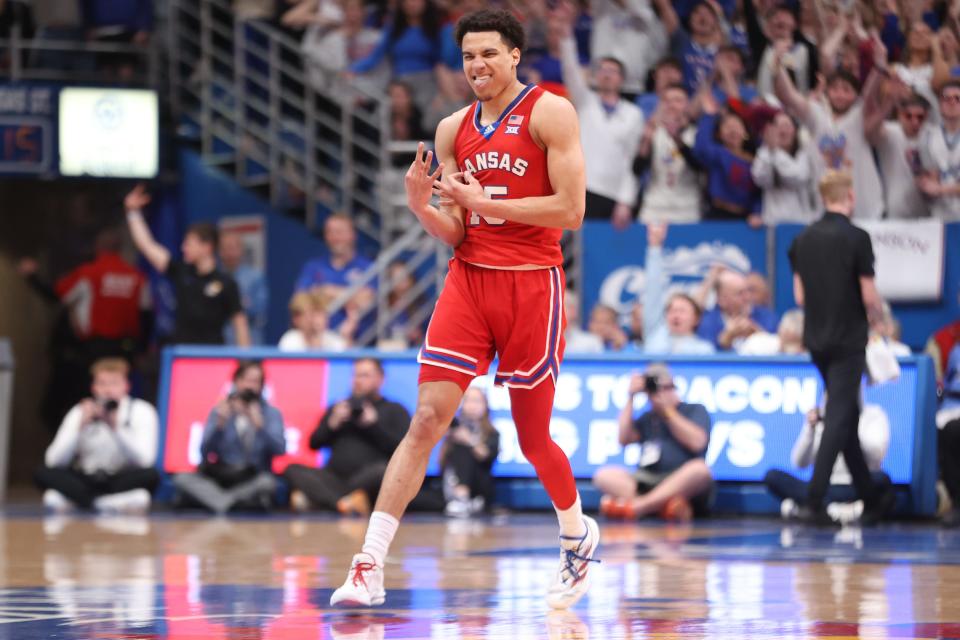 Kansas graduate senior guard Kevin McCullar Jr. (15) reacts after sinking a 3-pointer against Kansas State in the first half of the Sunflower Showdown inside Allen Fieldhouse on March 5, 2024.
