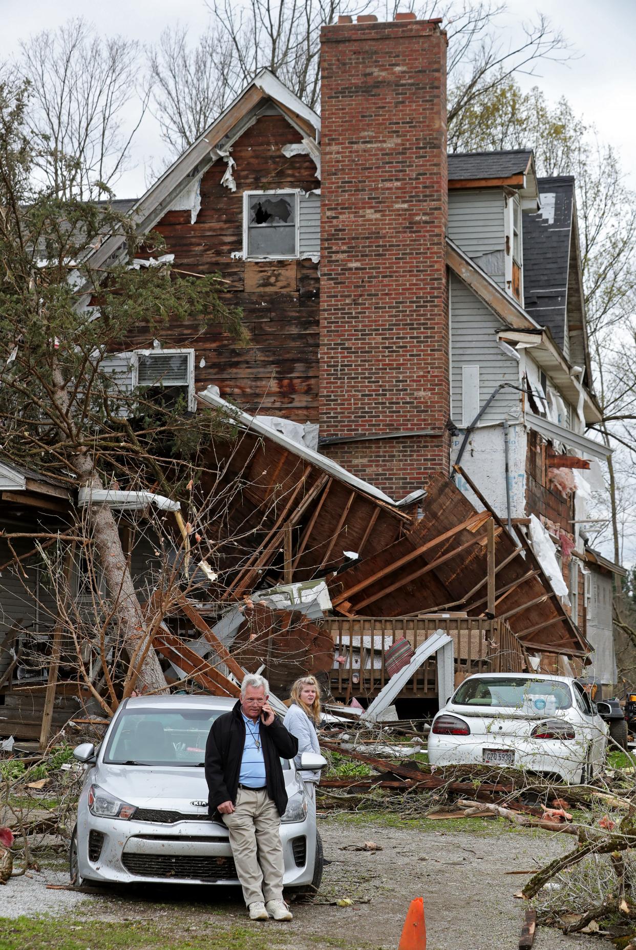 Tom Silver makes a phone call Thursday, April 18, 2024, after an EF-1 tornado caused significant damage to his home on Windham Parkman Road in Windham the night before.