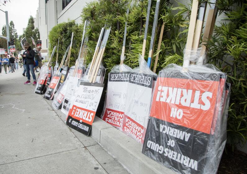 CULVER CITY, CA - MAY 09: Signs await distribution at the picket line at Sony Studios in Culver City on Tuesday, May 9, 2023 in Culver City, CA during the Writers Guild of America strike. (Myung J. Chun / Los Angeles Times)