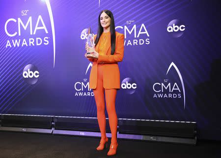 52nd Country Music Association Awards – Photo Room – Nashville, Tennessee, U.S., 14/11/2018. Kacey Musgraves, Album of the Year winner for Golden Hour, holds her award. REUTERS/Jamie Gilliam