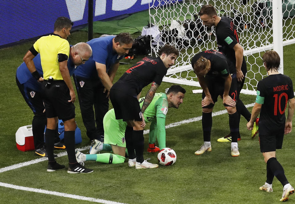 Croatia goalkeeper Danijel Subasic grimaces on the ground after injuring himself during the quarterfinal match between Russia and Croatia at the 2018 soccer World Cup at the Fisht Stadium in Sochi, Russia, Saturday, July 7, 2018. (AP Photo/Alexander Zemlianichenko)
