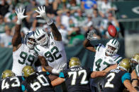 <p>New York Jets players Steve McLendon, Leonard Williams try to block a goal against Jacksonville Jaguars during their NFL football game in East Rutherford, New Jersey, U.S., October 1, 2017. REUTERS/Eduardo Munoz </p>