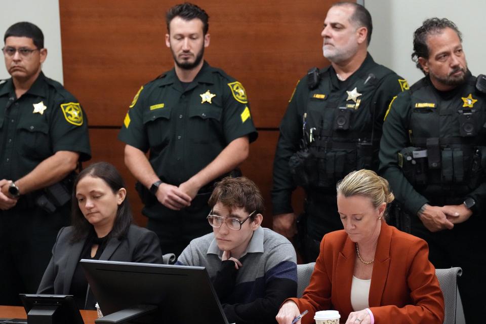 Marjory Stoneman Douglas High School shooter Nikolas Cruz, seated with sentence mitigation specialist Kate O'Shea, left, and Assistant Public Defender Melisa McNeill, is shown as the verdicts are read in his trial at the Broward County Courthouse in Fort Lauderdale on Oct. 13.