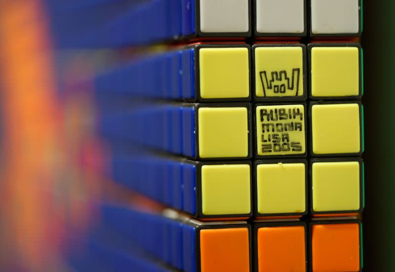 The sign of the French street artist Invader is seen on The Rubik Mona Lisa (2005) displayed at ArtCurial in Paris