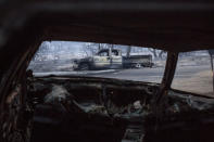 Burned vehicles are seen in the Lake Hughes fire in Angeles National Forest on Thursday, Aug. 13, 2020, north of Santa Clarita, Calif. (AP Photo/Ringo H.W. Chiu)