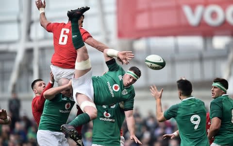 Ireland and Wales contest a line-out - Credit: Charles McQuillan/Getty Images