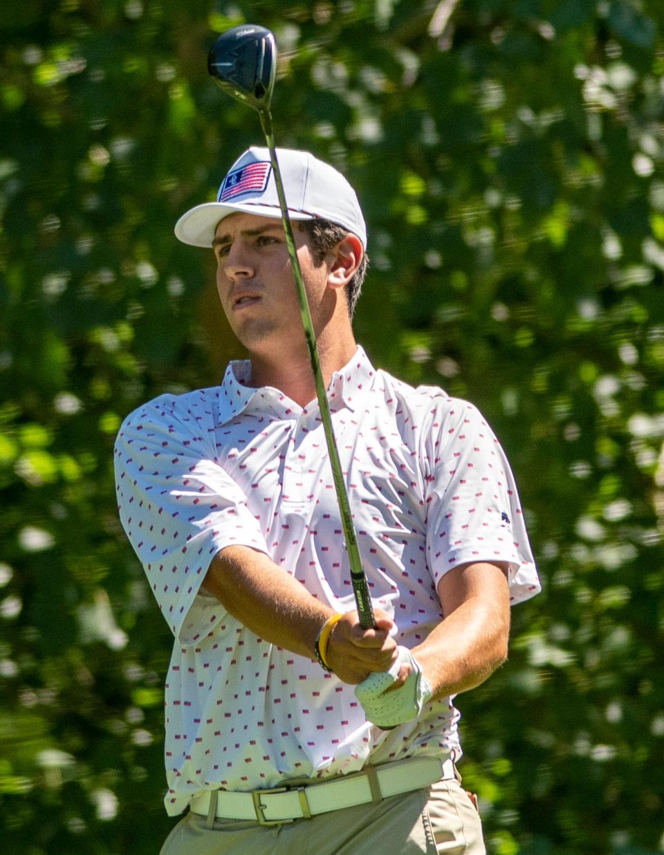 Ethan Whitney watches his tee shot on the 14th hole Sunday during the Worcester County Amateur golf tournament at Wachusett Country Club.