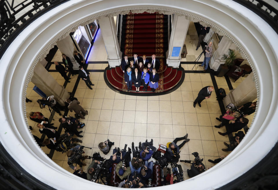 Eleven British politicians who have joined new political party 'The Independent Group' pose for a photograph after a press conference in Westminster in London, Wednesday, Feb. 20, 2019. Cracks in Britain's political party system yawned wider Wednesday, as three pro-European lawmakers - Soubry, Allen and Wollaston - quit the governing Conservatives to join a newly formed centrist group of independents who are opposed to the government's plan for Britain's departure from the European Union. (AP Photo/Kirsty Wigglesworth)