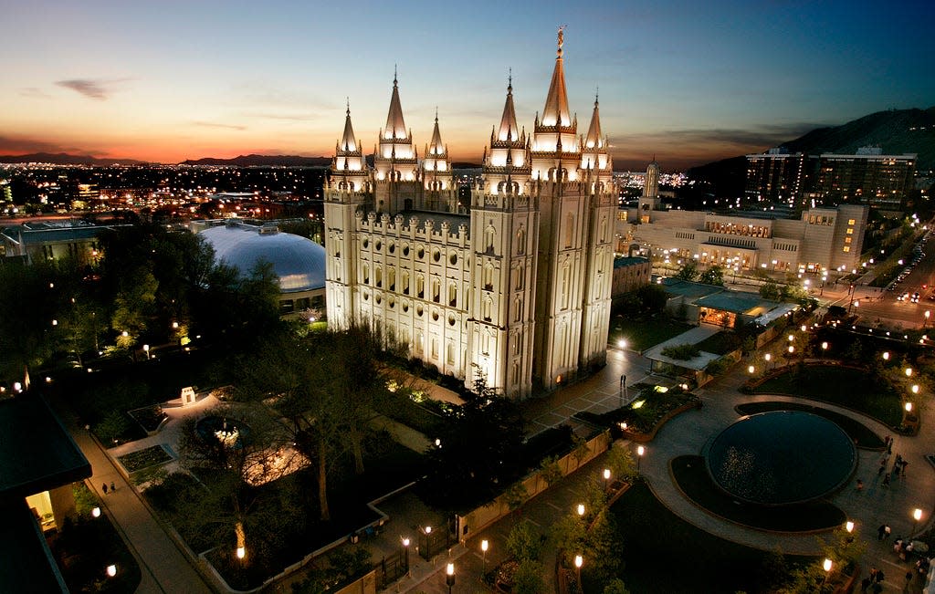 FILE - In this April 27, 2006 file photo, the sun sets behind the Mormon Temple, the centerpiece of Temple Square in Salt Lake City. A federal lawsuit filed Tuesday, Oct. 31, 2023 against The Church of Jesus Christ of Latter-Day Saints and its investment arm alleges the faith misused hundreds of thousands of dollars donated by three men by investing the money instead of using it for charitable purposes as they claim was promised. (AP Photo/Douglas C. Pizac, File)