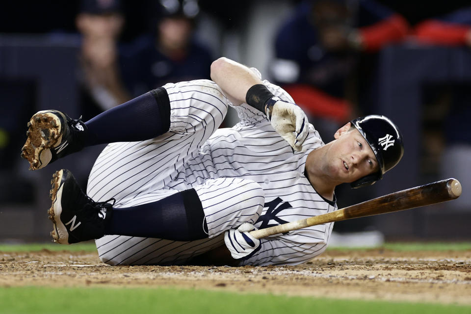 New York Yankees' DJ LeMahieu reacts after fouling a ball off of himself against the Boston Red Sox during the seventh inning of a baseball game Saturday, June 10, 2023, in New York. (AP Photo/Adam Hunger)