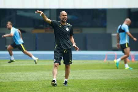 Football Soccer - Manchester City training - International Champions Cup China - Olympic Sports Centre, Beijing, China - 24/7/16 - Manchester City coach Pep Guardiola attends training. REUTERS/Thomas Peter