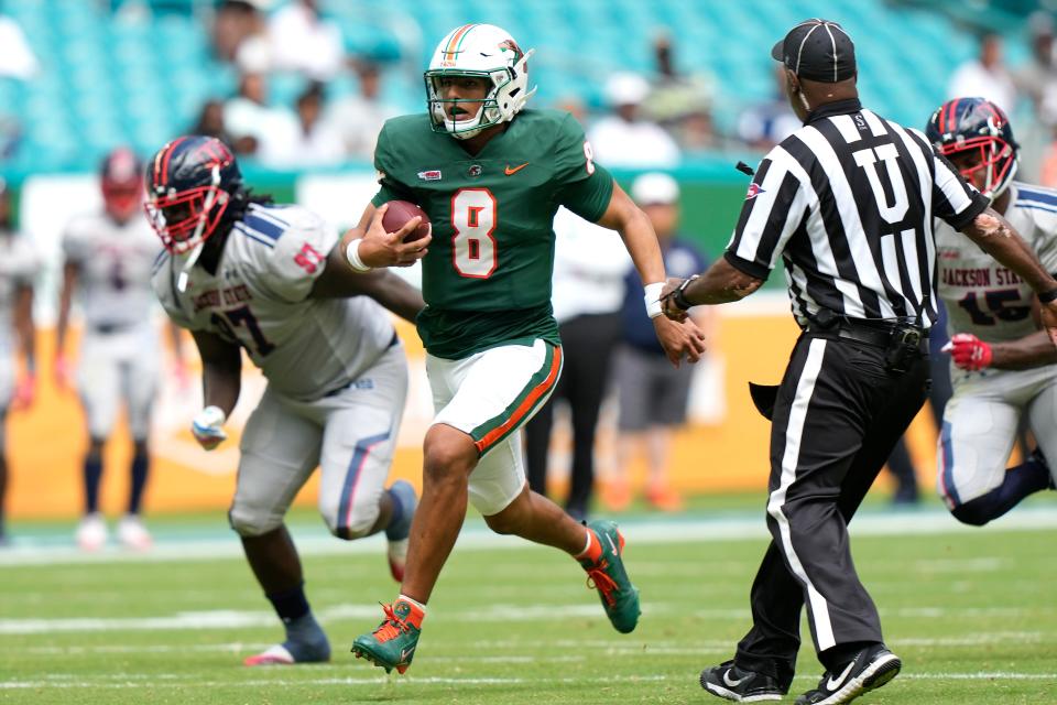Florida A&M quarterback Jeremy Moussa (8) runs for a first down during the first half of the Orange Blossom Classic NCAA college football game against Jackson State, Sunday, Sept. 3, 2023, in Miami Gardens, Fla. (AP Photo/Lynne Sladky)