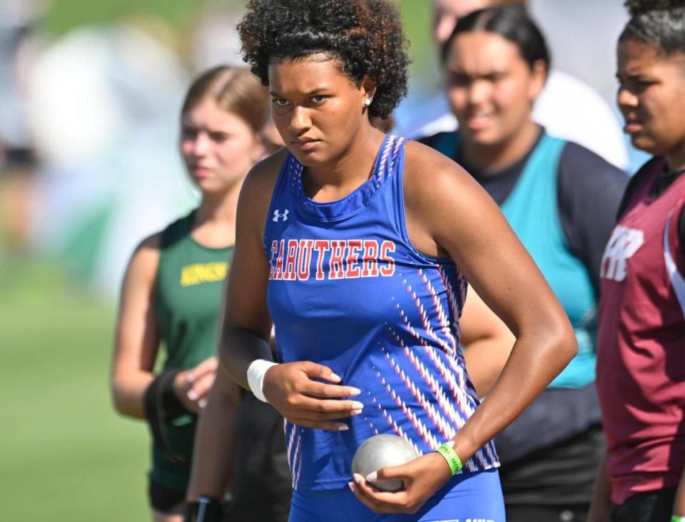 Caruthers’ Nailea Fields waits for her turn in the girls shot put at the CIF Central Section track and field Masters, May 20, 2023 in Clovis.