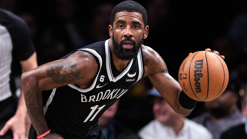 Kyrie Irving dribbles the ball during an NBA game for the Brooklyn Nets.