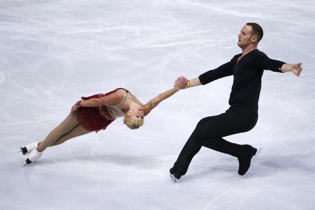 US Caydee Denney and John Coughlin perform during the figure skating event at the 2013 Eric Bompard trophy on November 15, 2013 at the Bercy Palais-Omnisport (POPB) in Paris. AFP PHOTO / KENZO TRIBOUILLARD        (Photo credit should read KENZO TRIBOUILLARD/AFP/Getty Images)