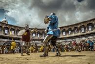 <p>Two would-be knights from team Moldova and team France in their recreated historical armour fight in the 5×5 full contact competition at the World Championship in Historical Medieval Battles, ‘Battle of the Nations’, in Barcelona. (Rex features) </p>