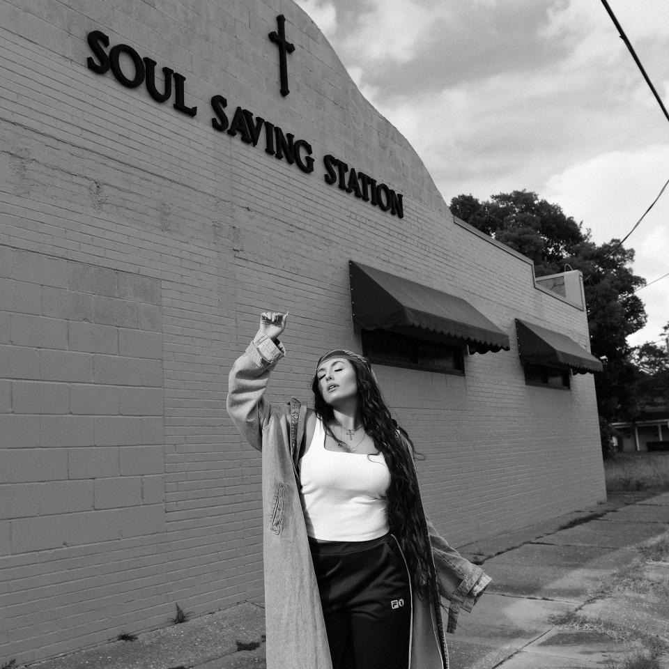 Wilmington singer Annie Tracy outside the Soul Saving Station on Dawson Street.
