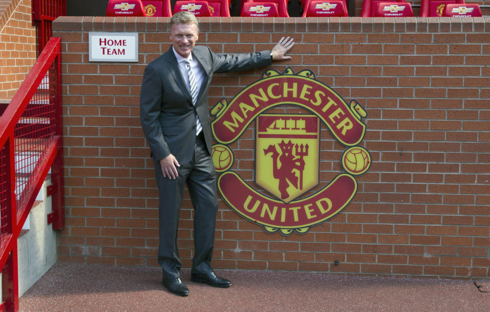 FILE - In this Friday July 5, 2013 file photo Manchester United's new manager David Moyes poses for pictures before a press conference at Old Trafford Stadium, Manchester, England. Manchester United says manager David Moyes has left the Premier League club after less than a year in charge, amid heavy speculation he was about to be fired. United released a brief statement in its website Tuesday, saying the club "would like to place on record its thanks for the hard work, honesty and integrity he brought to the role." (AP Photo/Jon Super, File)